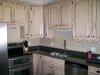 Distressed Oak cabinets with Antique white and van dyke brown glaze